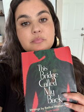 Image of Camila Gavin-Bravo holding a book 