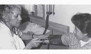 Healthcare worker tending to patient